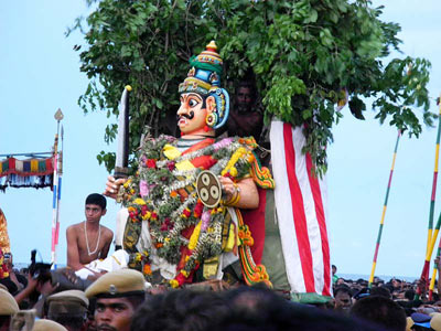The demon Surapadman prepares to attack Lord Murugan.